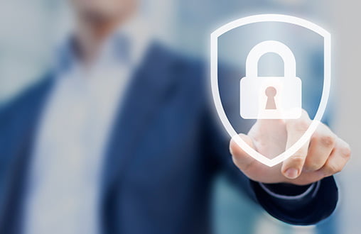 Image of man pointing to an image of a security shield with lock inside, demonstrating T-Base’s secure infrastructure.